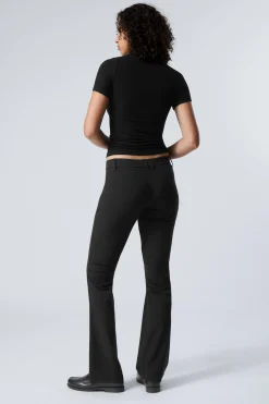 Weekday SLIM LOW WAIST FLARED PLEATED TROUSERS><noscript><img width=